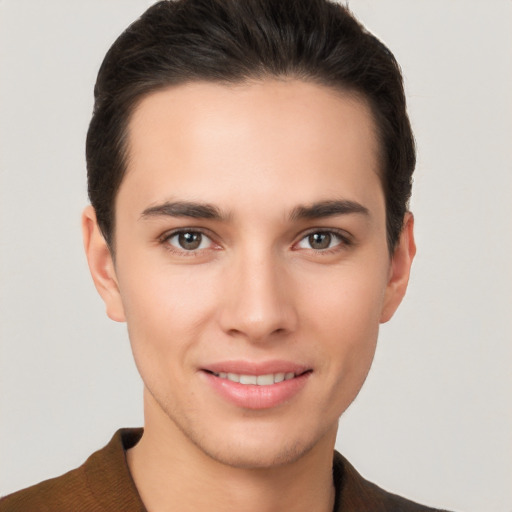 Joyful white young-adult male with short  brown hair and brown eyes