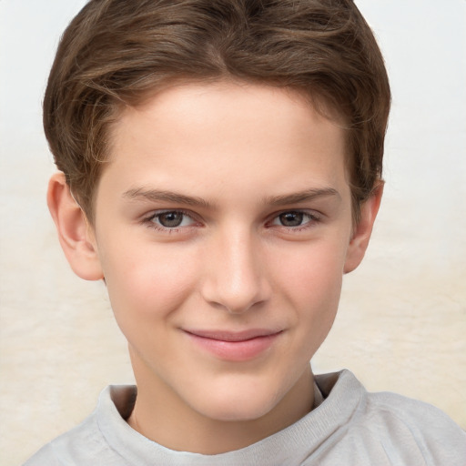 Joyful white child male with short  brown hair and brown eyes