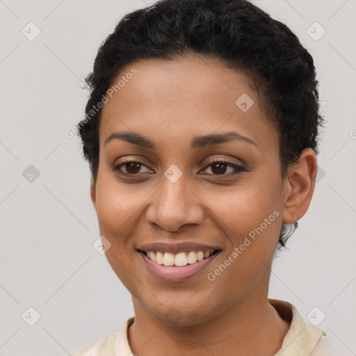 Joyful latino young-adult female with short  brown hair and brown eyes