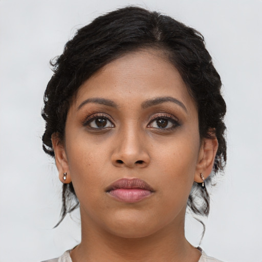 Neutral latino young-adult female with long  brown hair and brown eyes