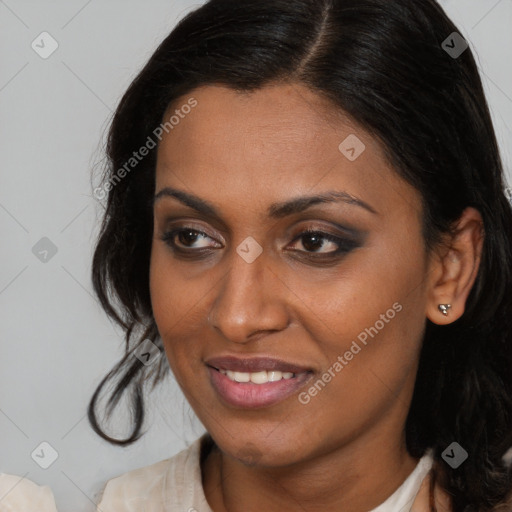 Joyful latino young-adult female with medium  brown hair and brown eyes