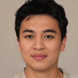 Joyful asian young-adult male with short  black hair and brown eyes