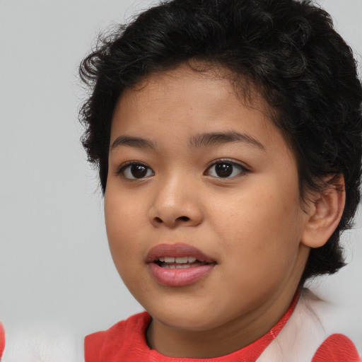 Joyful asian child female with short  brown hair and brown eyes
