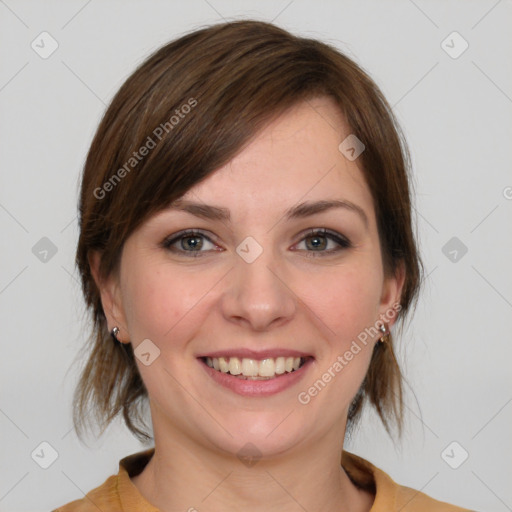 Joyful white young-adult female with medium  brown hair and grey eyes