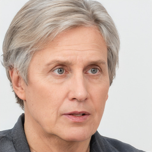 Neutral white middle-aged male with short  gray hair and grey eyes