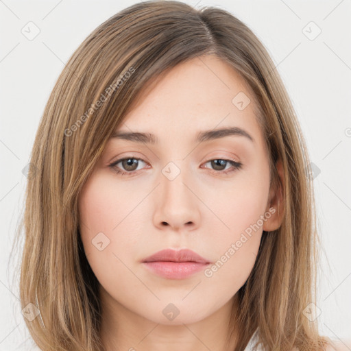 Neutral white young-adult female with long  brown hair and brown eyes