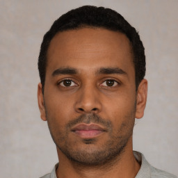 Neutral black young-adult male with short  black hair and brown eyes