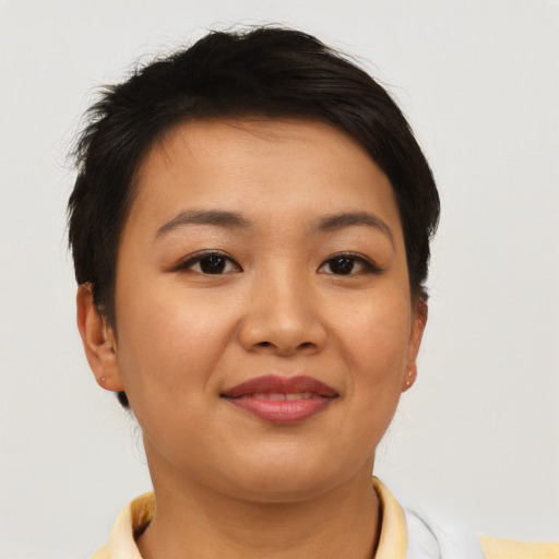 Joyful asian young-adult female with short  brown hair and brown eyes