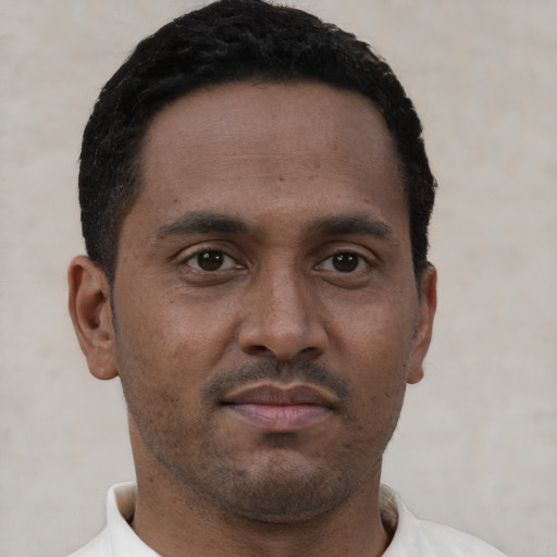 Neutral latino young-adult male with short  brown hair and brown eyes