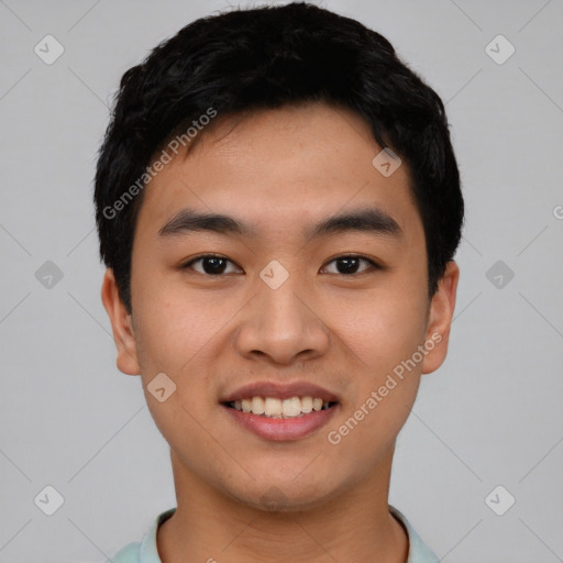 Joyful asian young-adult male with short  black hair and brown eyes