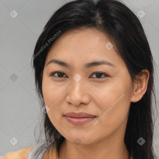 Joyful latino young-adult female with long  brown hair and brown eyes