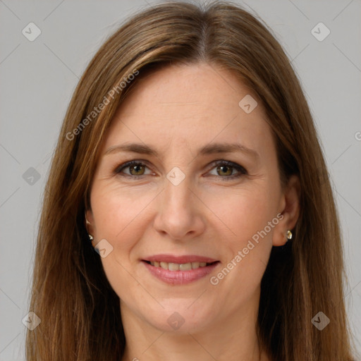 Joyful white adult female with long  brown hair and brown eyes