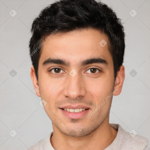 Joyful white young-adult male with short  black hair and brown eyes