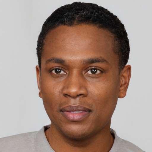 Neutral black young-adult male with short  black hair and brown eyes