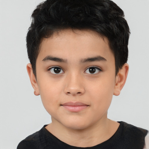 Joyful latino child male with short  brown hair and brown eyes