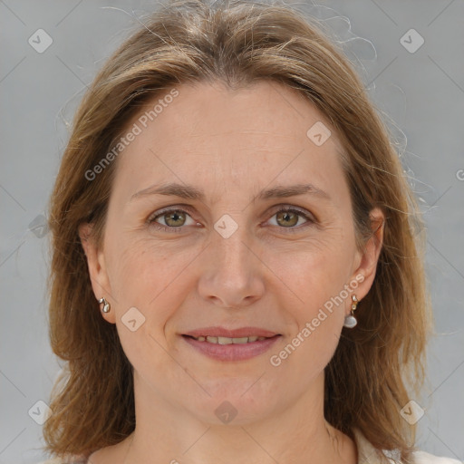 Joyful white adult female with medium  brown hair and grey eyes