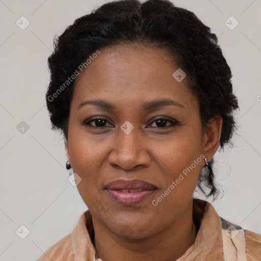 Joyful black adult female with short  brown hair and brown eyes