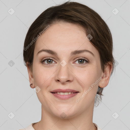 Joyful white young-adult female with medium  brown hair and grey eyes