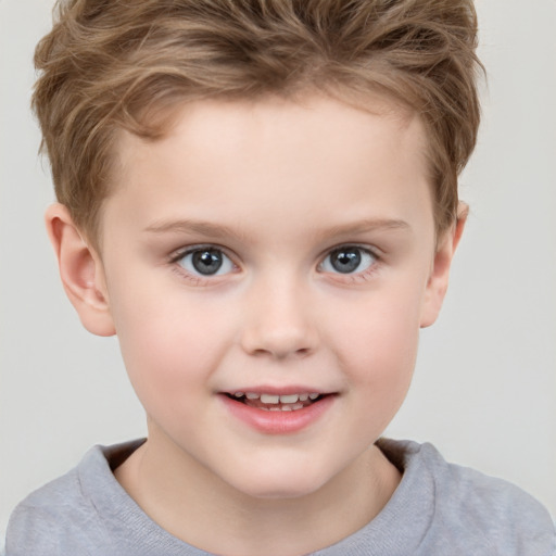 Joyful white child male with short  brown hair and grey eyes