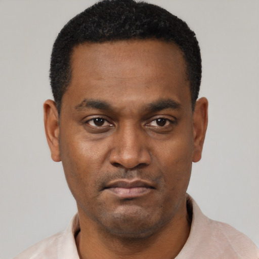 Neutral black young-adult male with short  black hair and brown eyes