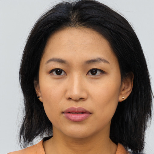 Neutral asian young-adult female with medium  brown hair and brown eyes