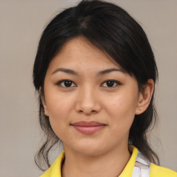 Joyful asian young-adult female with medium  black hair and brown eyes