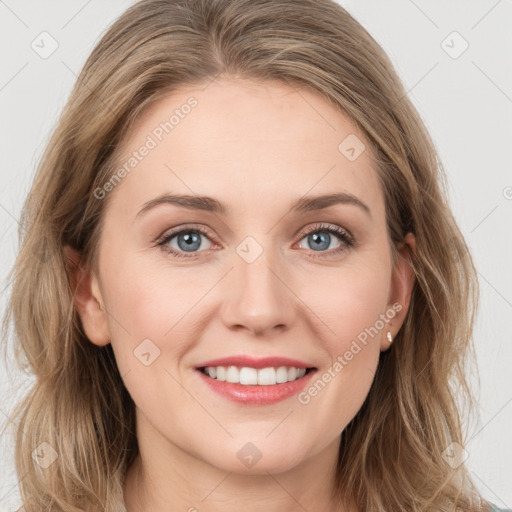 Joyful white young-adult female with long  brown hair and blue eyes