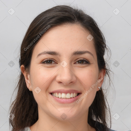 Joyful white young-adult female with long  brown hair and brown eyes