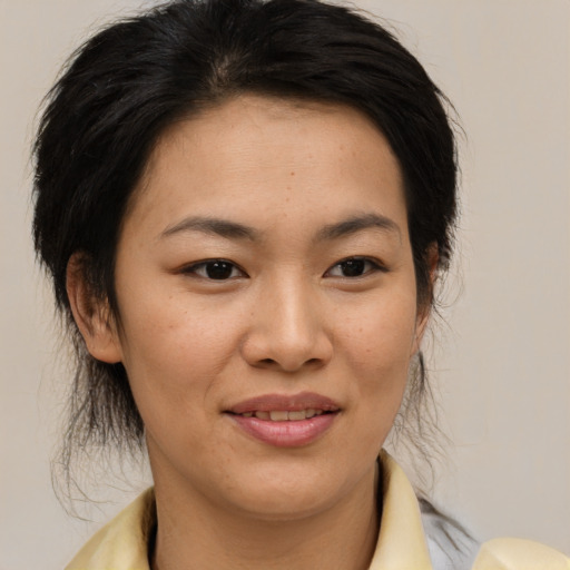 Joyful white young-adult female with medium  brown hair and brown eyes