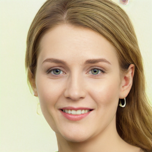 Joyful white young-adult female with long  brown hair and green eyes