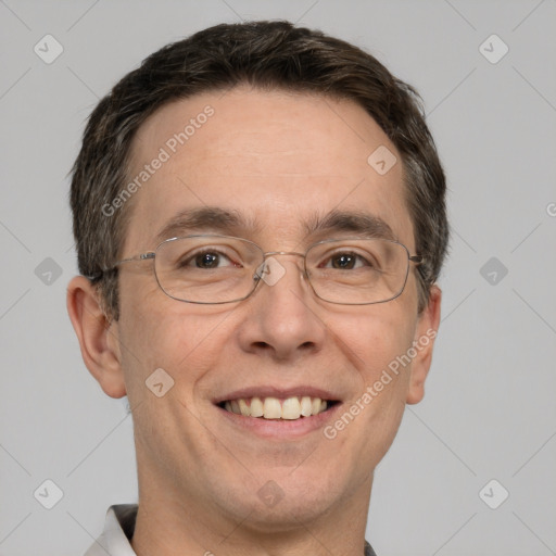 Joyful white adult male with short  brown hair and grey eyes