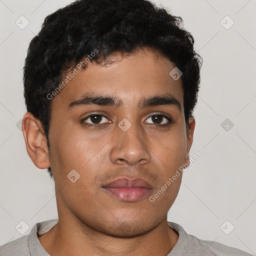 Neutral latino young-adult male with short  brown hair and brown eyes