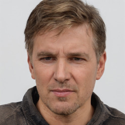 Joyful white adult male with short  brown hair and grey eyes