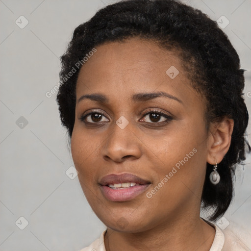 Joyful black young-adult female with medium  black hair and brown eyes