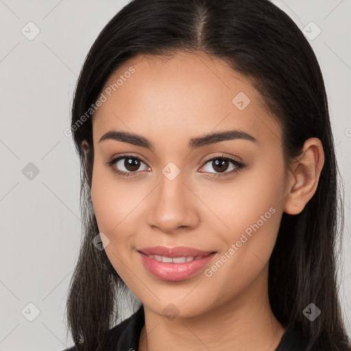 Joyful white young-adult female with long  black hair and brown eyes