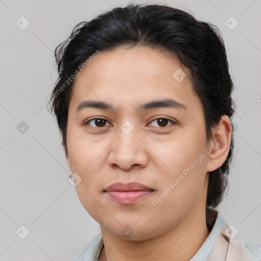 Joyful latino young-adult female with medium  brown hair and brown eyes