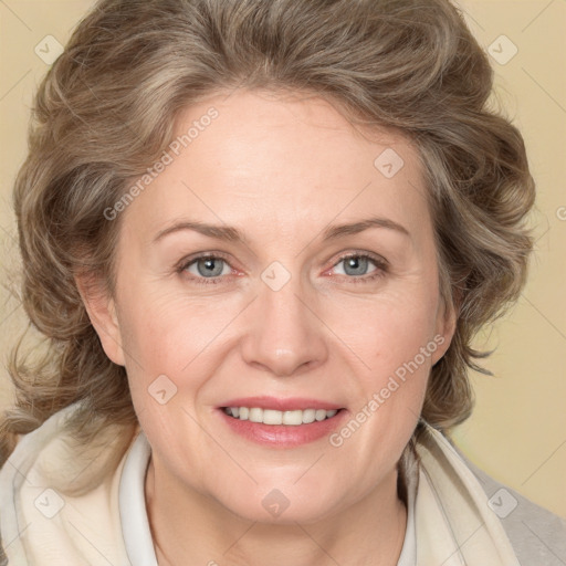 Joyful white adult female with medium  brown hair and blue eyes