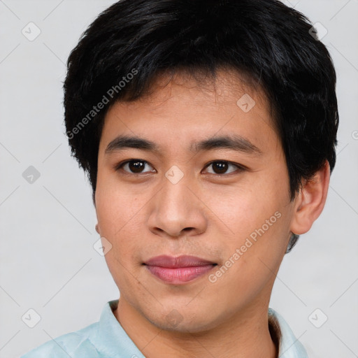 Joyful asian young-adult male with short  black hair and brown eyes