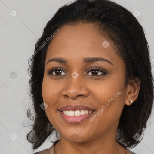 Joyful black young-adult female with medium  brown hair and brown eyes