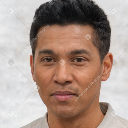 Joyful asian adult male with short  black hair and brown eyes