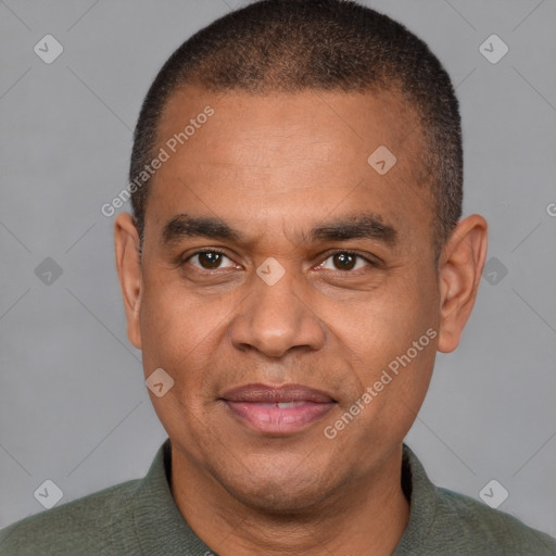 Joyful latino adult male with short  brown hair and brown eyes