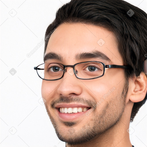 Joyful white young-adult male with short  black hair and brown eyes