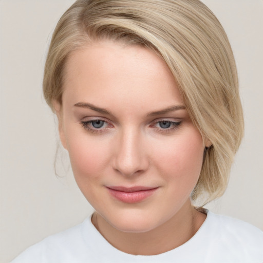 Joyful white young-adult female with medium  brown hair and blue eyes