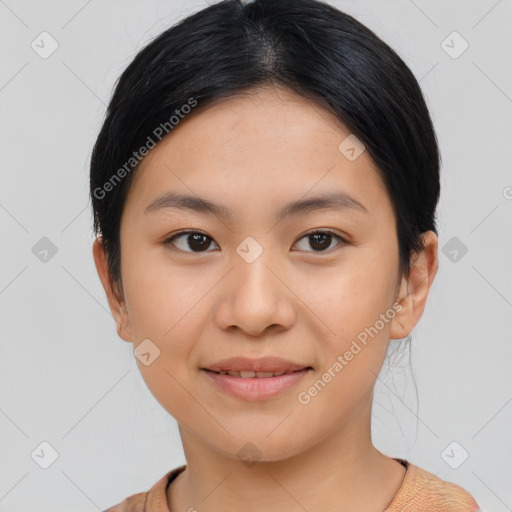 Joyful asian young-adult female with short  black hair and brown eyes