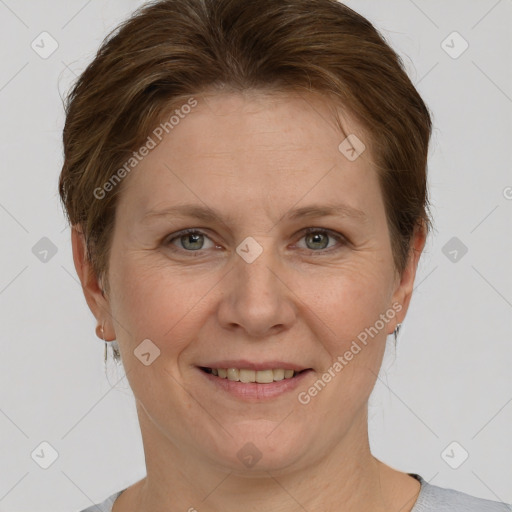 Joyful white adult female with short  brown hair and grey eyes