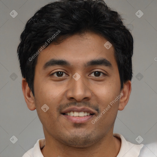 Joyful latino young-adult male with short  black hair and brown eyes