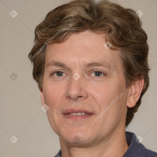 Joyful white adult male with short  brown hair and grey eyes