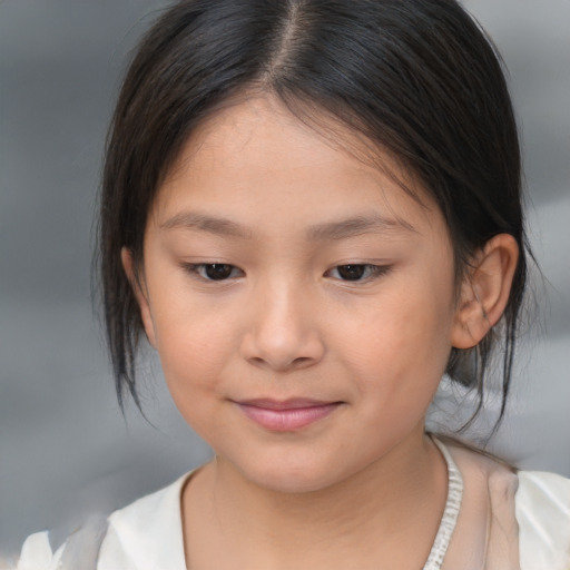Joyful asian child female with medium  brown hair and brown eyes