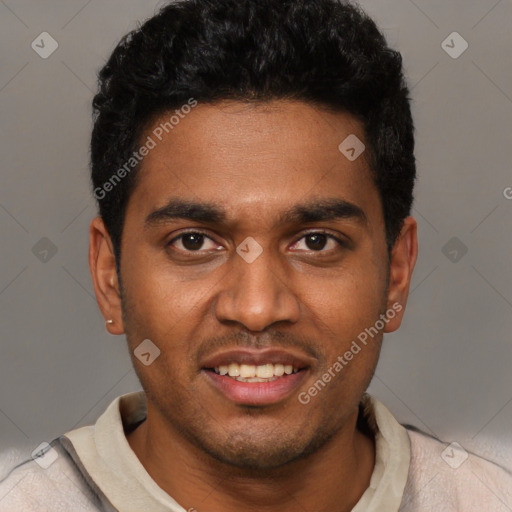 Joyful black young-adult male with short  black hair and brown eyes