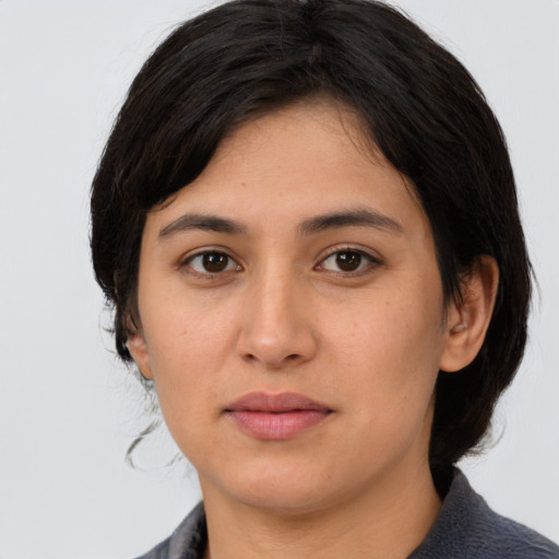 Neutral white young-adult female with medium  brown hair and brown eyes